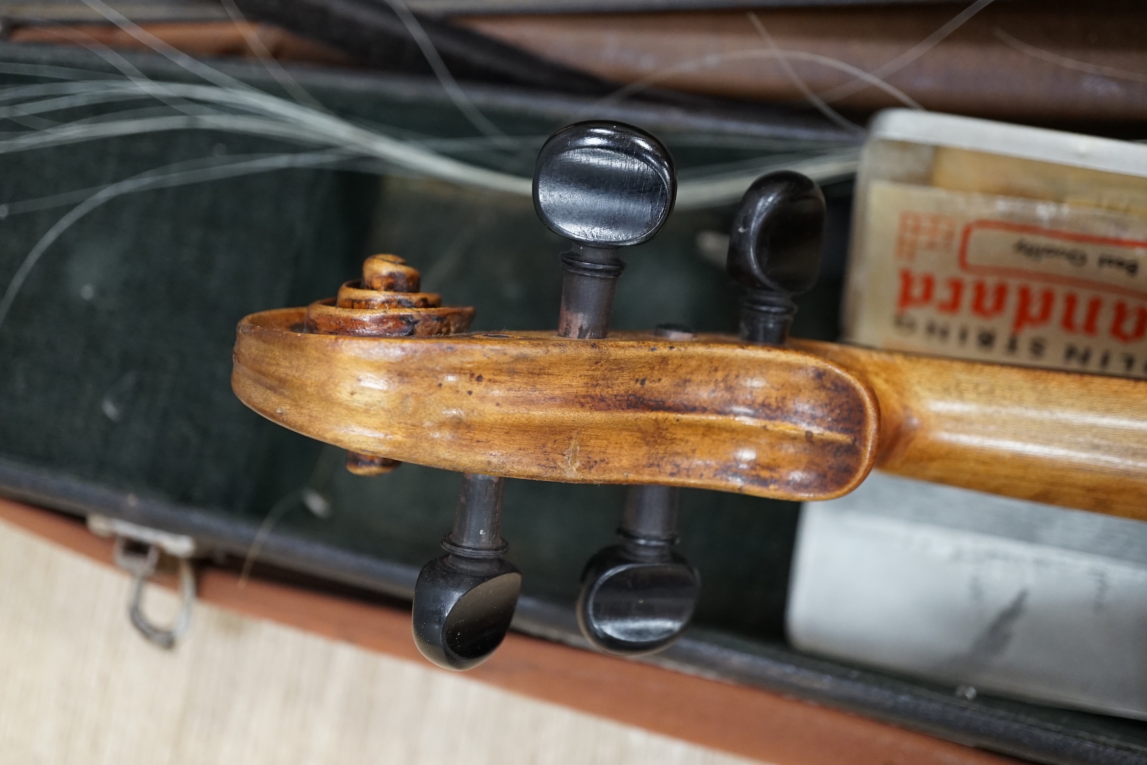 A cased 19th century German violin with paper label for Schweitzer copy Amati Pestini, length of body, 36cm, with bow CITES Submission reference 97BD7MYU